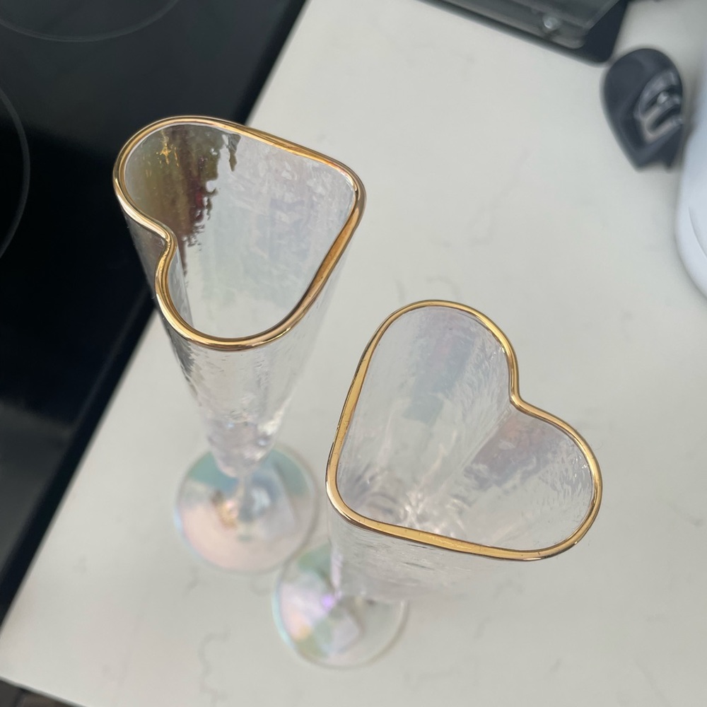 Iridescent heart shaped champagne glasses